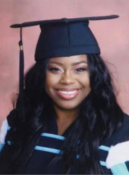 Khadeja Raven Anderson poses in a mortar board and grad gown. She has a big warm smile, long dark hair and beautiful eyes.